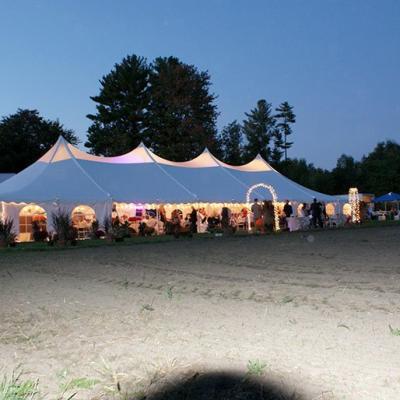 Perimeter String And Par 38 Lighting In A Translucent Peak Tent